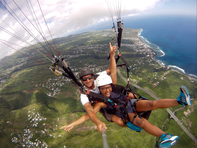 Tandem paragliding flight over the lagoon of Saint Leu, Reunion Island Tandem paragliding flight over the lagoon of Saint Leu, Reunion Island